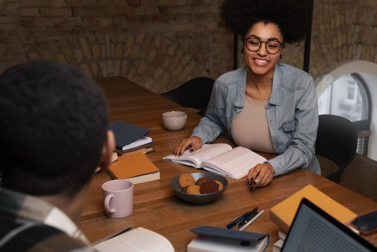 Professional working on financial analysis with calculator and documents on desk
